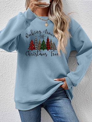 Misty Blue crewneck sweatshirt with a graphic of Christmas trees and "Rocking Around the Christmas Tree" text.