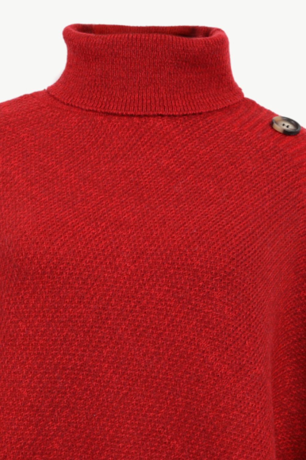 Deep red acrylic turtleneck poncho with button detail on shoulder