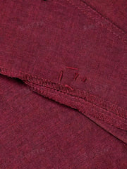 Burgundy vest detail showing stitching and raw edges.