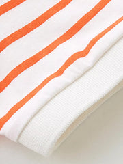 White and orange striped baby polo shirt detail with ribbed cuff