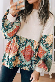 Beige peplum knit top with patchwork paisley print sleeves and hem