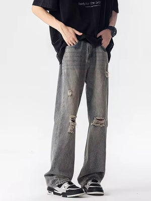 Men's grey distressed loose fit jeans with ripped details