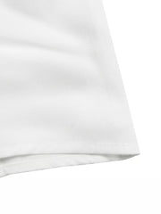White midi dress with cap sleeves and a tie detail, showing hem detail.
