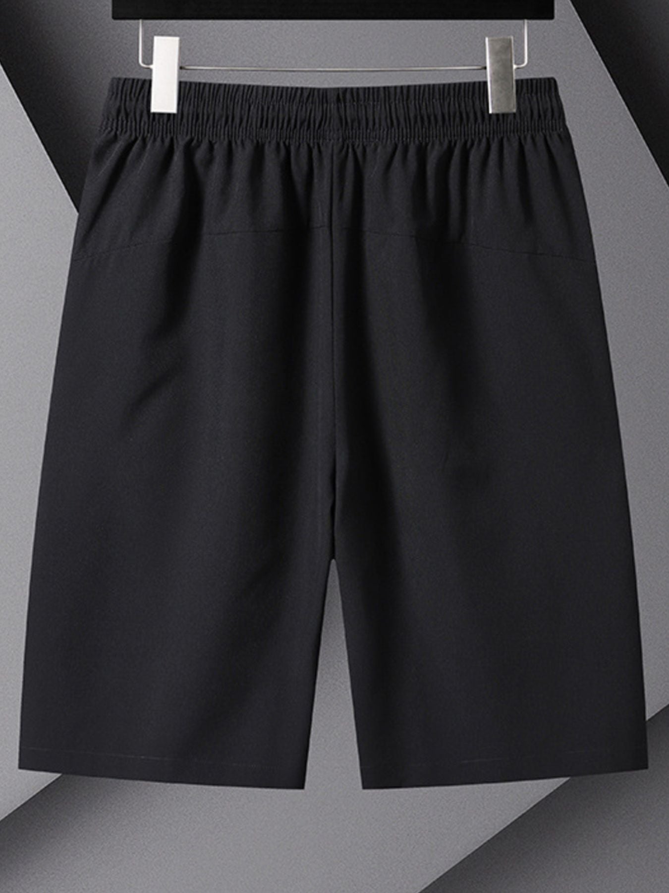 Men's black athletic shorts with drawstring and pockets.