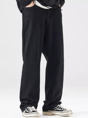 Black wide-leg jeans for men with a relaxed fit, styled casually.