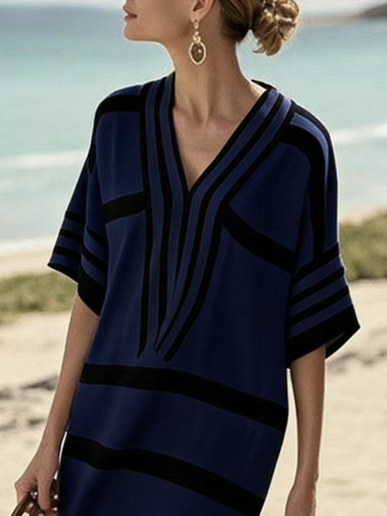 Blue and black striped half sleeve midi dress with a V-neck.