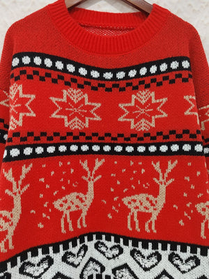 Red acrylic knit sweater with Fair Isle reindeer and snowflake pattern.
