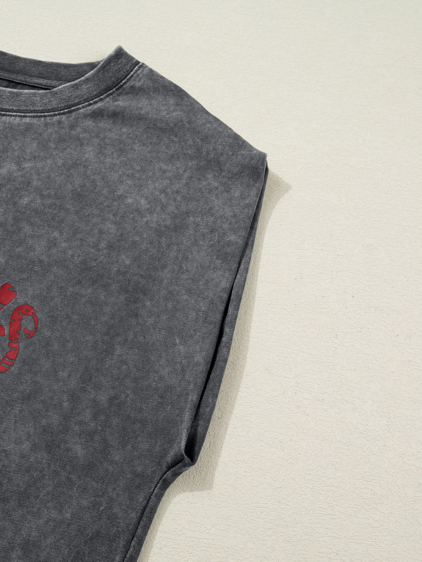 Dark gray acid-washed cotton tank top with red graphic detail