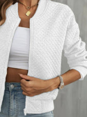 White diamond quilted bomber jacket with a zip front and crew neck.