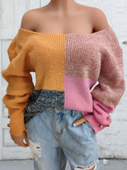 Colorblock knit sweater with off-the-shoulder neckline and button cuff detail.