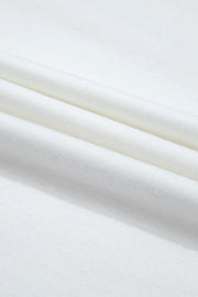 White loungewear fabric detail showing soft folds and texture.