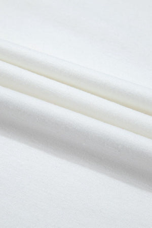 White loungewear fabric detail showing soft folds and texture.