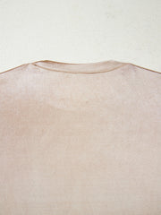 Sleeveless champagne tank top with a lustrous metallic finish and crew neckline.