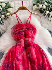 Pink floral mesh maxi dress with ruched bodice and spaghetti straps.