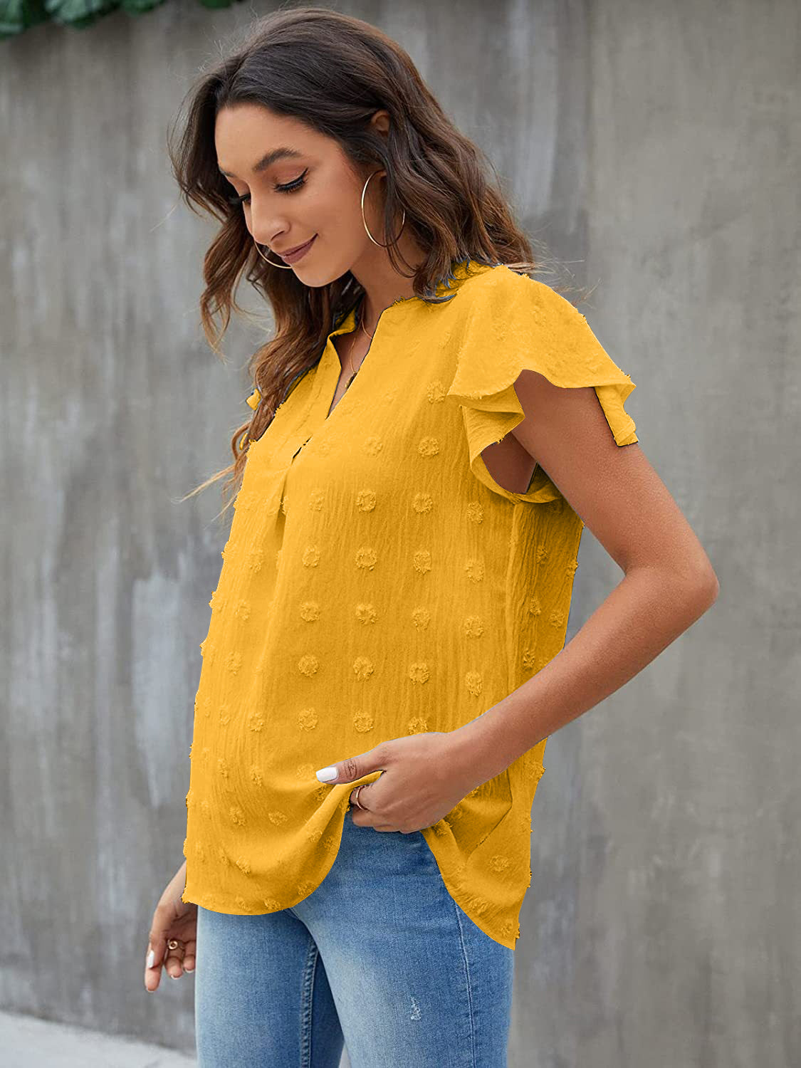 Textured voile blouse in gold with flutter sleeves and a v-neckline.