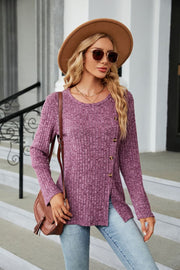 Ribbed tunic top in dusty blue with asymmetric hem and button detail.