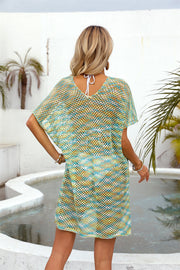 Open-knit caftan with V-neck and short sleeves in a striped teal, yellow, and white pattern.