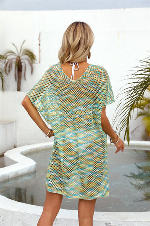 Open-knit caftan with V-neck and short sleeves in a striped teal, yellow, and white pattern.