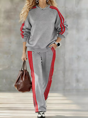 Grey loungewear set with red stripes on sleeves and pants.