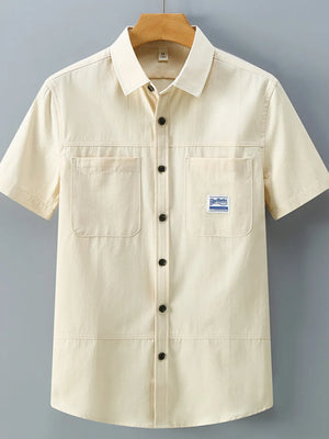 Apricot cotton utility shirt with two chest pockets and button front.