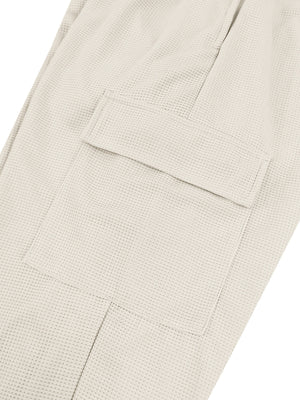 Textured waffle knit joggers in light gray with a cargo pocket detail.