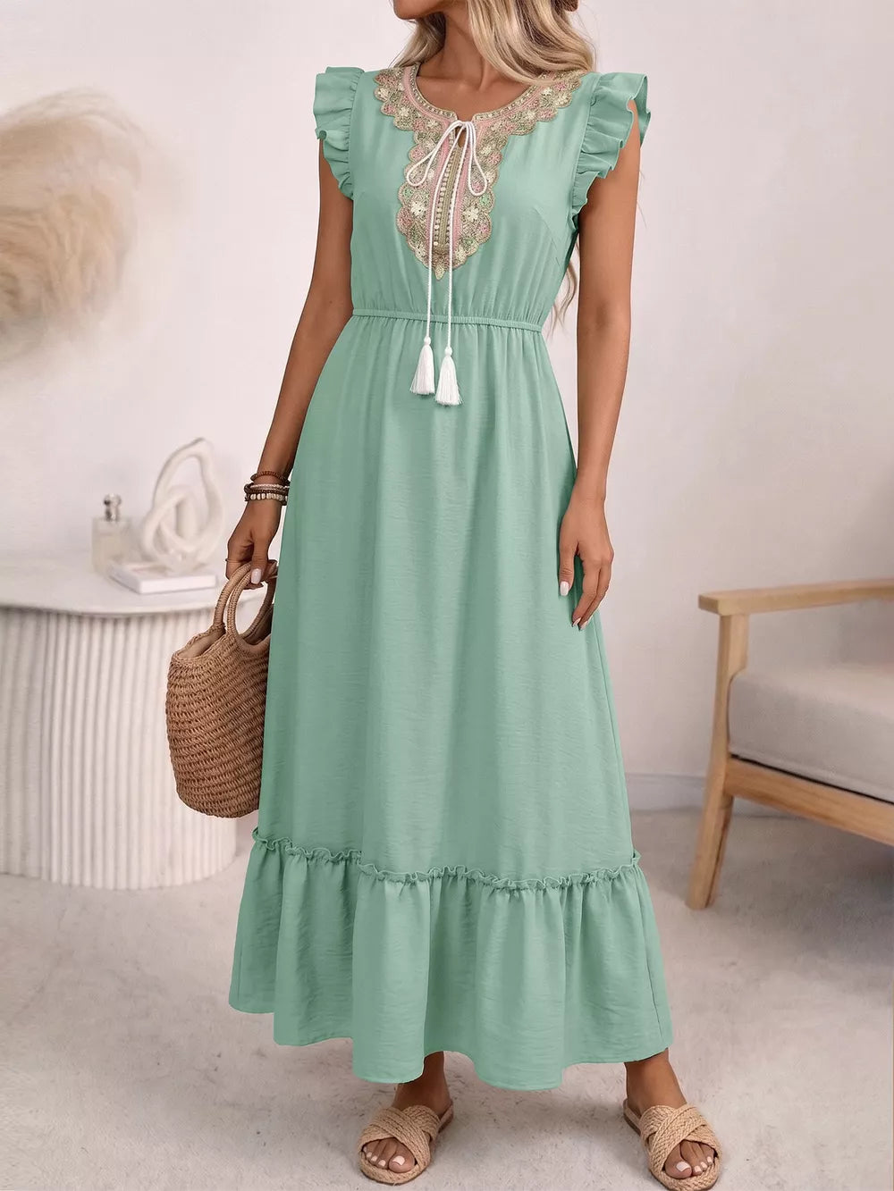 Mint green embroidered tie neck maxi dress with ruffles and tassels.
