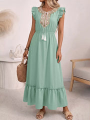 Mint green embroidered tie neck maxi dress with ruffles and tassels.