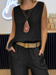 Black relaxed fit tank and wide-leg pants set with a statement necklace.