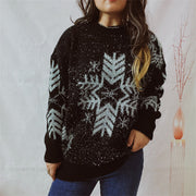Black acrylic sweater with silver snowflake pattern and sparkly threads.