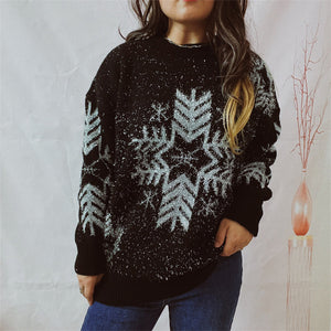 Black acrylic sweater with silver snowflake pattern and sparkly threads.