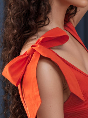 Orange ribbed knit tank top with bow shoulder straps