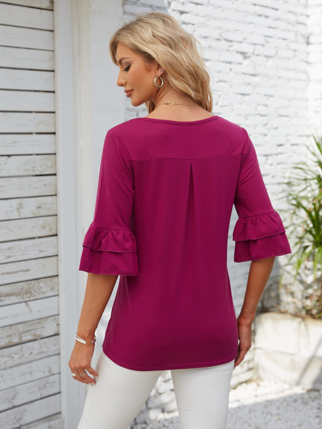 Ruffled sleeve blouse in watermelon pink with a square neckline and back pleat detail.