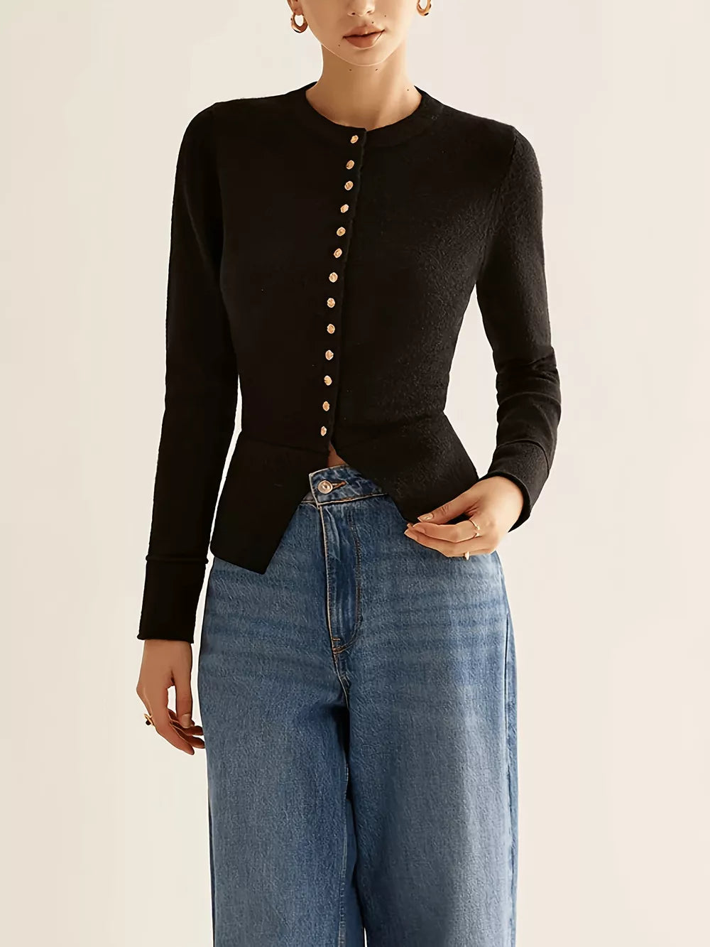 Black button-down slim fit cardigan with gold buttons and a curved hem.