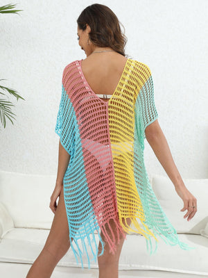 Colorblock crochet cover-up with fringe in pastel blue, pink, yellow, and green.