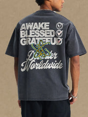Washed black graphic tee with "AWAKE BLESSED GRATEFUL" text and atom graphic.