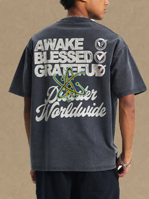 Washed black graphic tee with "AWAKE BLESSED GRATEFUL" text and atom graphic.