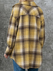 Oversized plaid shacket with patch pockets in yellow and brown plaid.