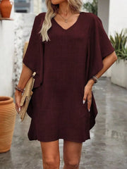 Burgundy mini dress with v-neck and ruffled sleeves.