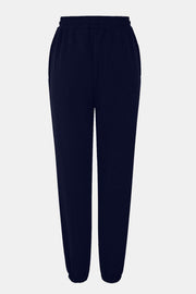 Navy sweatpants with gathered cuffs and elastic waistband.