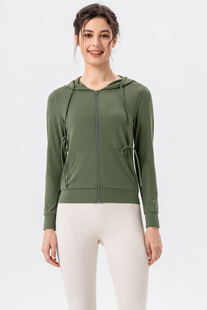 Matcha green zip-up hoodie with drawstrings and pockets.