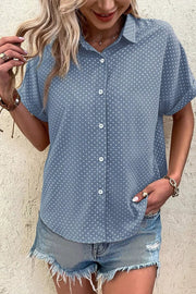 Blue polka dot cuffed short sleeve polyester shirt with button front.