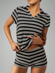 Chic striped knit two-piece set in black stripes with a collared top and shorts.