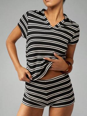Chic striped knit two-piece set in black stripes with a collared top and shorts.