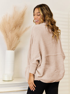 Cocoon knit cardigan in Tan with pockets and dolman sleeves.