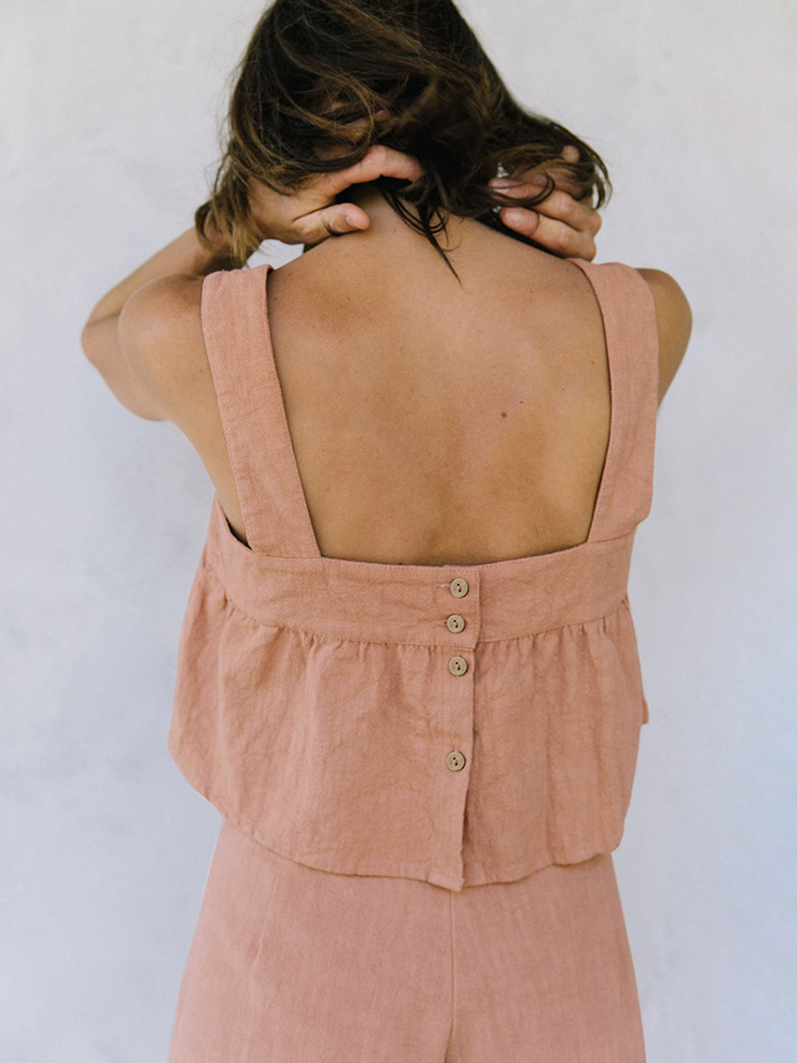 Watermelon pink linen crop top with button back detail and culottes.
