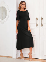Black midi dress with short sleeves and a scoop neckline, featuring an A-line cut.
