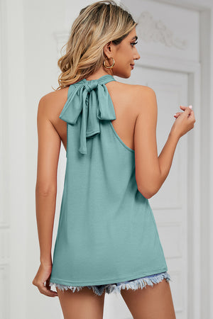 Light green halter tank top with a large bow detail at the back neckline.
