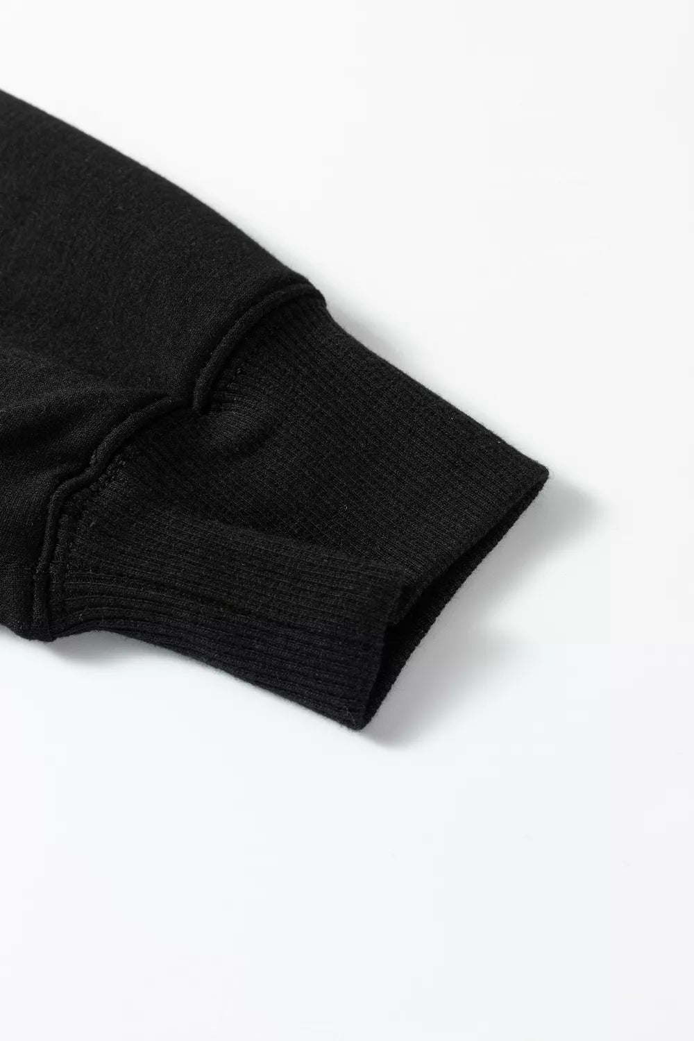 Black collared v-neck sweatshirt sleeve cuff detail