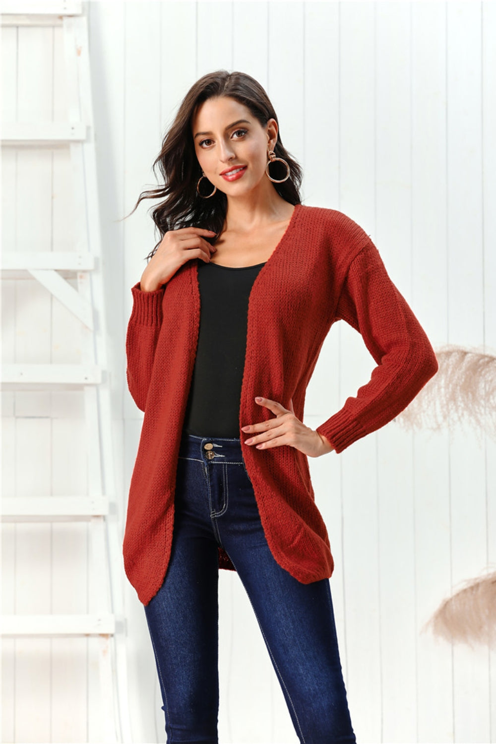 Draped knit open-front cardigan in deep red, 100% acrylic, with a relaxed fit and long sleeves.