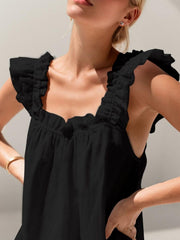 Black ruffled top pajamas with square neckline and short sleeves.